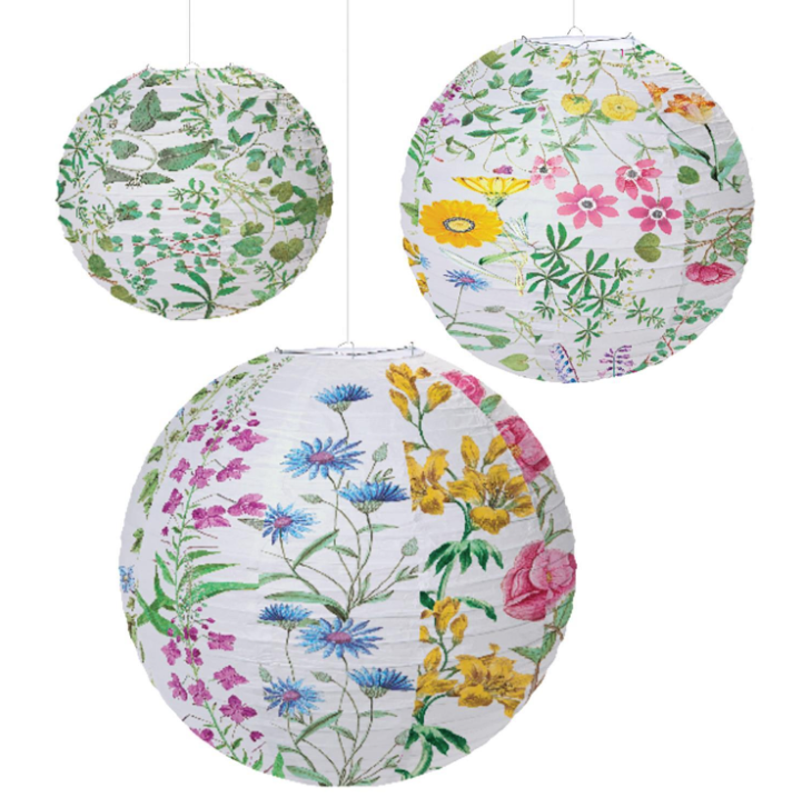 Three round hanging paper lanterns with white backgrounds and colorful wildflower prints, shown against a plain white background.