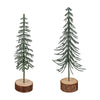 Two miniature Christmas trees on wooden bases against a white background