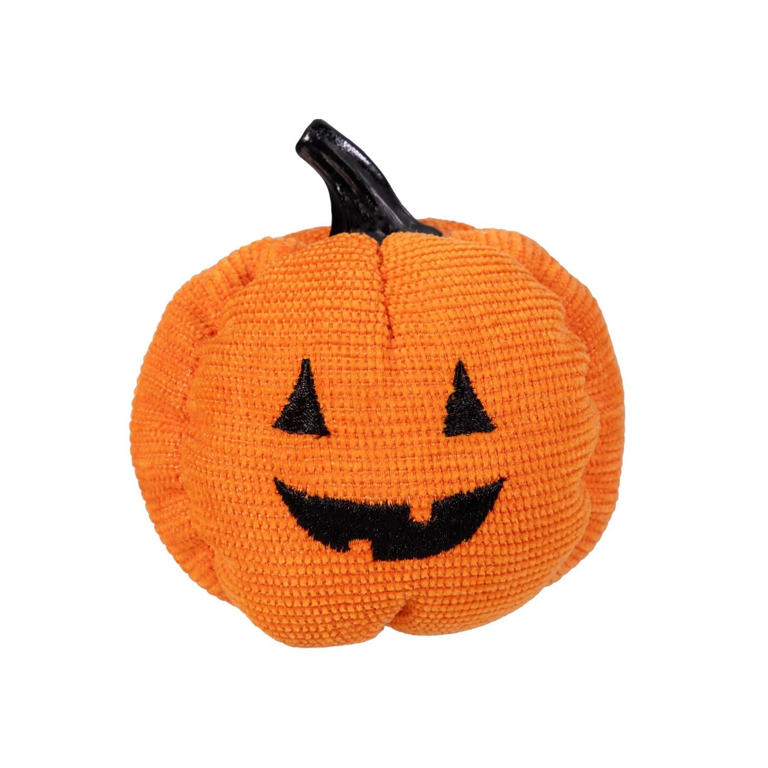 Fabric pumpkin with a face on a white background