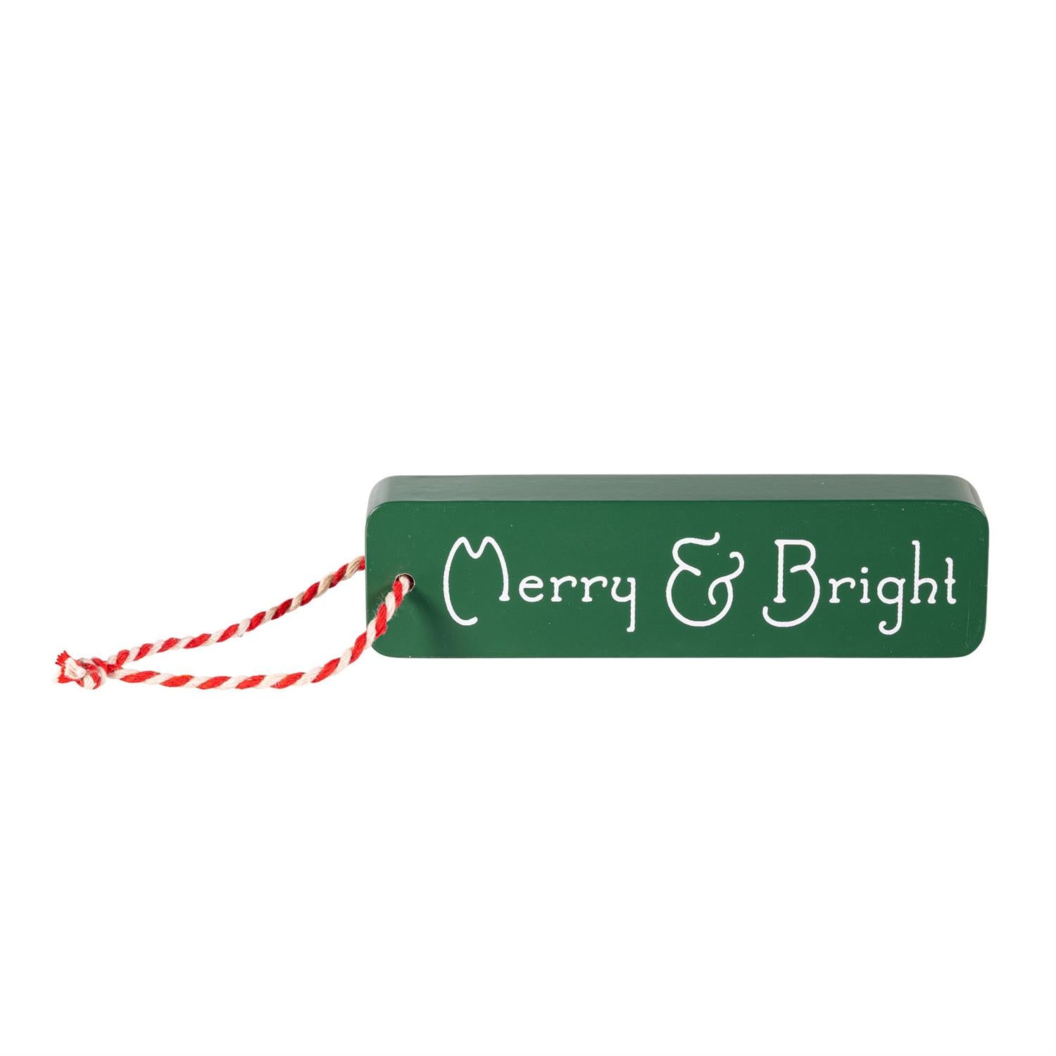 Green sign with 'Merry & Bright' text and red string on a white background