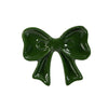 Green bow-shaped ceramic trinket on a white background