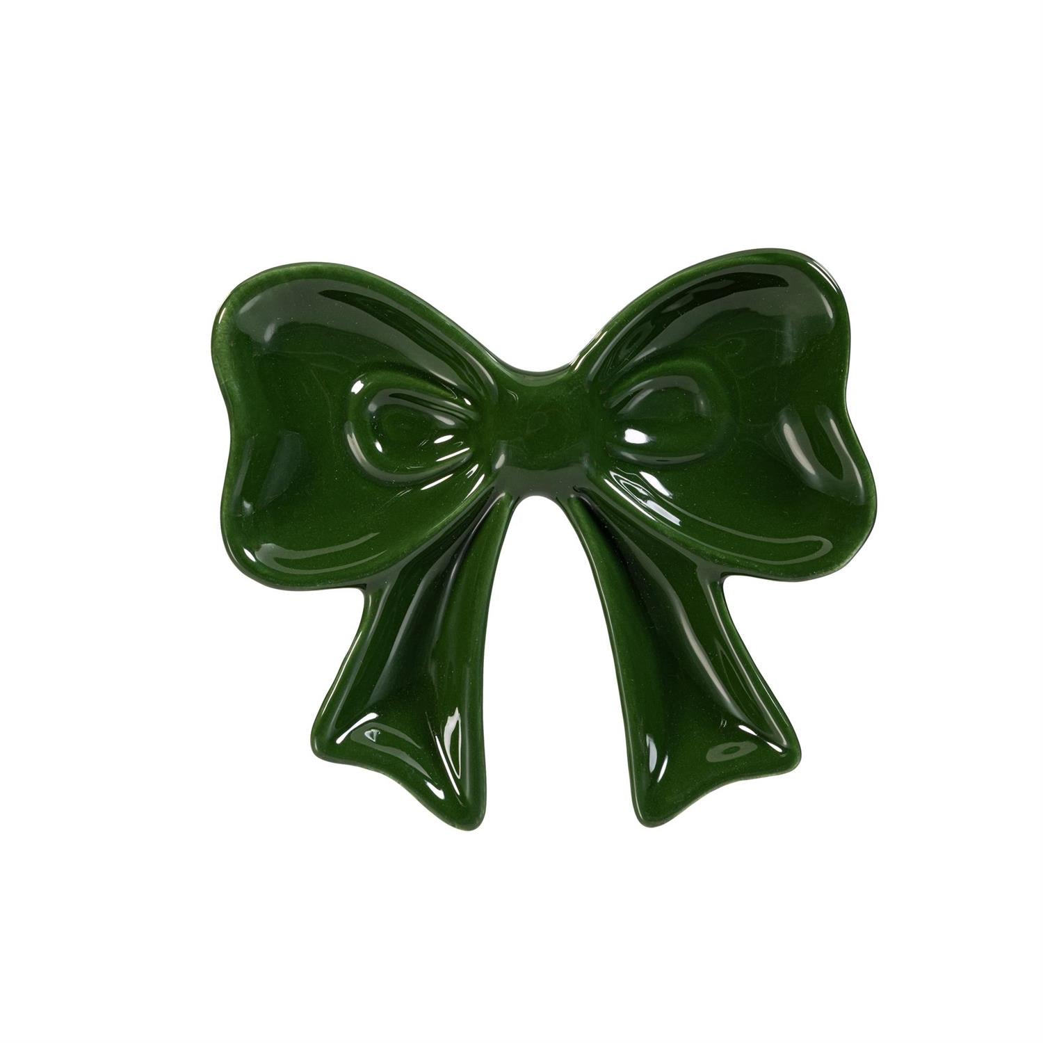 Green bow-shaped ceramic trinket on a white background