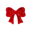 Red bow-shaped ceramic trinket on a white background