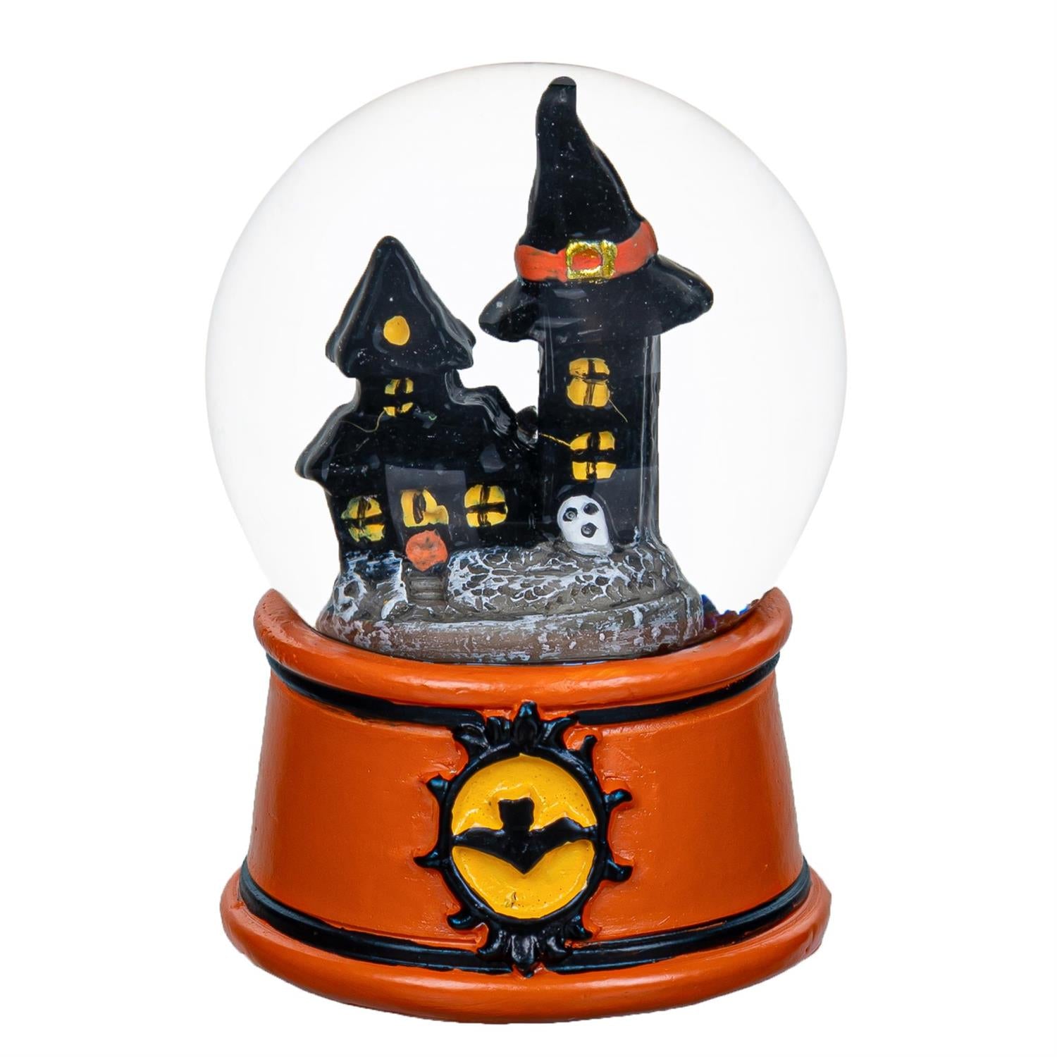 Halloween-themed snow globe with haunted house design on a white background