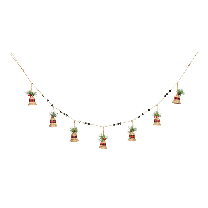 Decorative garland with bells and holly greenery and berries on a white background
