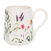 White mug with floral design on a white background
