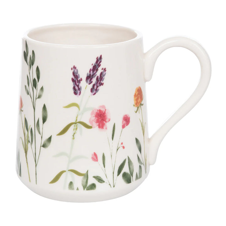 White mug with floral design on a white background
