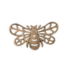 Bronze bee-shaped decorative trivet on a white background