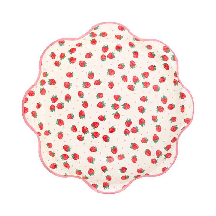 Scalloped-edge plate with strawberry pattern on a white background