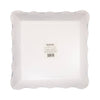 White paper plates with scalloped edge on a white background