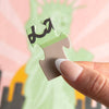 Hand holding a green puzzle piece against a colorful background