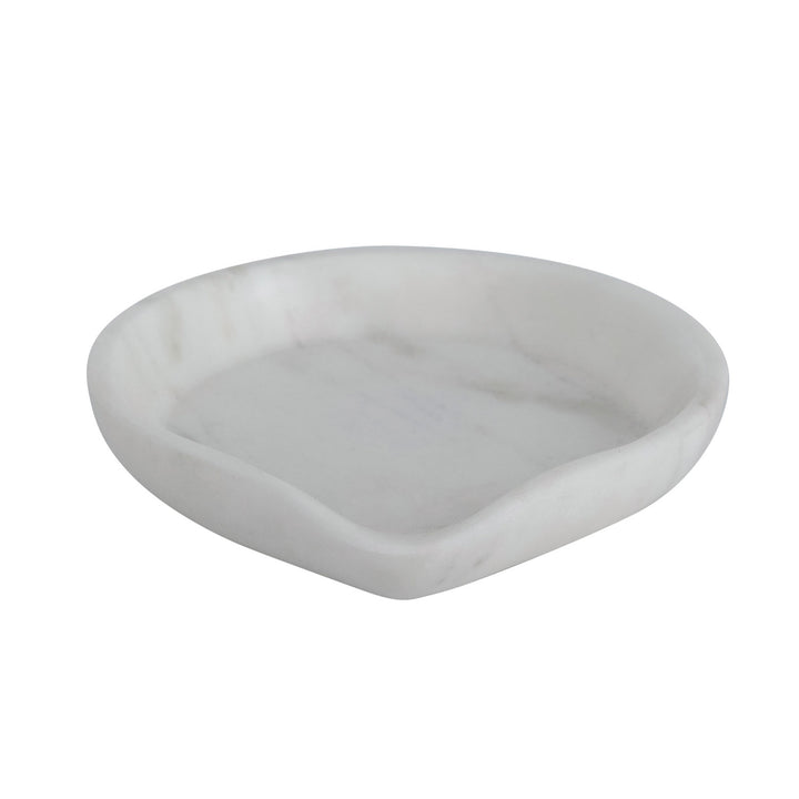 A white marble spoon rest with grey veining on a white background.