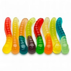 Colorful gummy worms arranged in a row on a white background