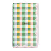 Checkered napkin with a scalloped edge in pastel colors on a white background