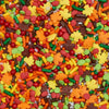 Colorful assortment of autumn-themed sprinkles including leaves.