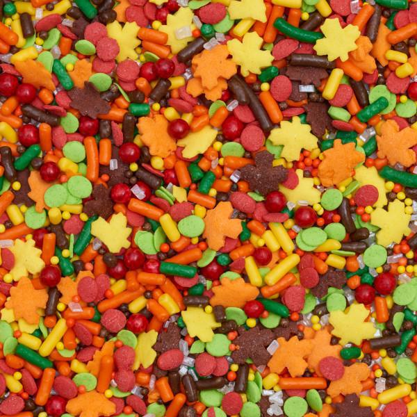 Colorful assortment of autumn-themed sprinkles including leaves.