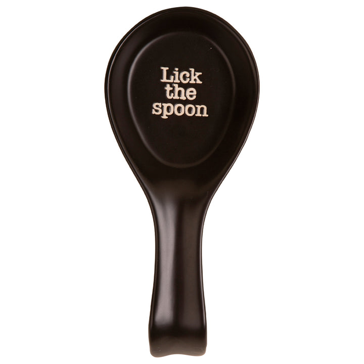Black spoon rest with 'Lick the spoon' text on a white background