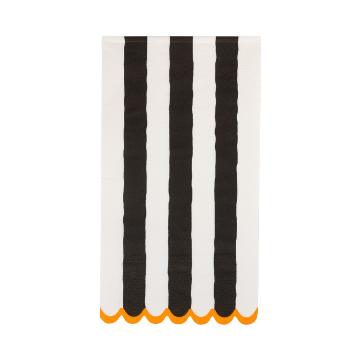 Striped napkin with black and white vertical stripes and orange scalloped edge on a white background
