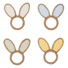 Four bunny ear napkin rings with different checkered patterns on a white background