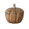 Wooden pumpkin-shaped container with a lid on a white background
