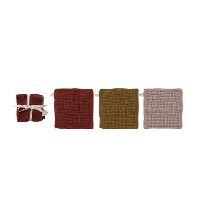 Textured kitchen dishcloths on a white background.