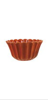 One orange ceramic stoneware bowl on a white background