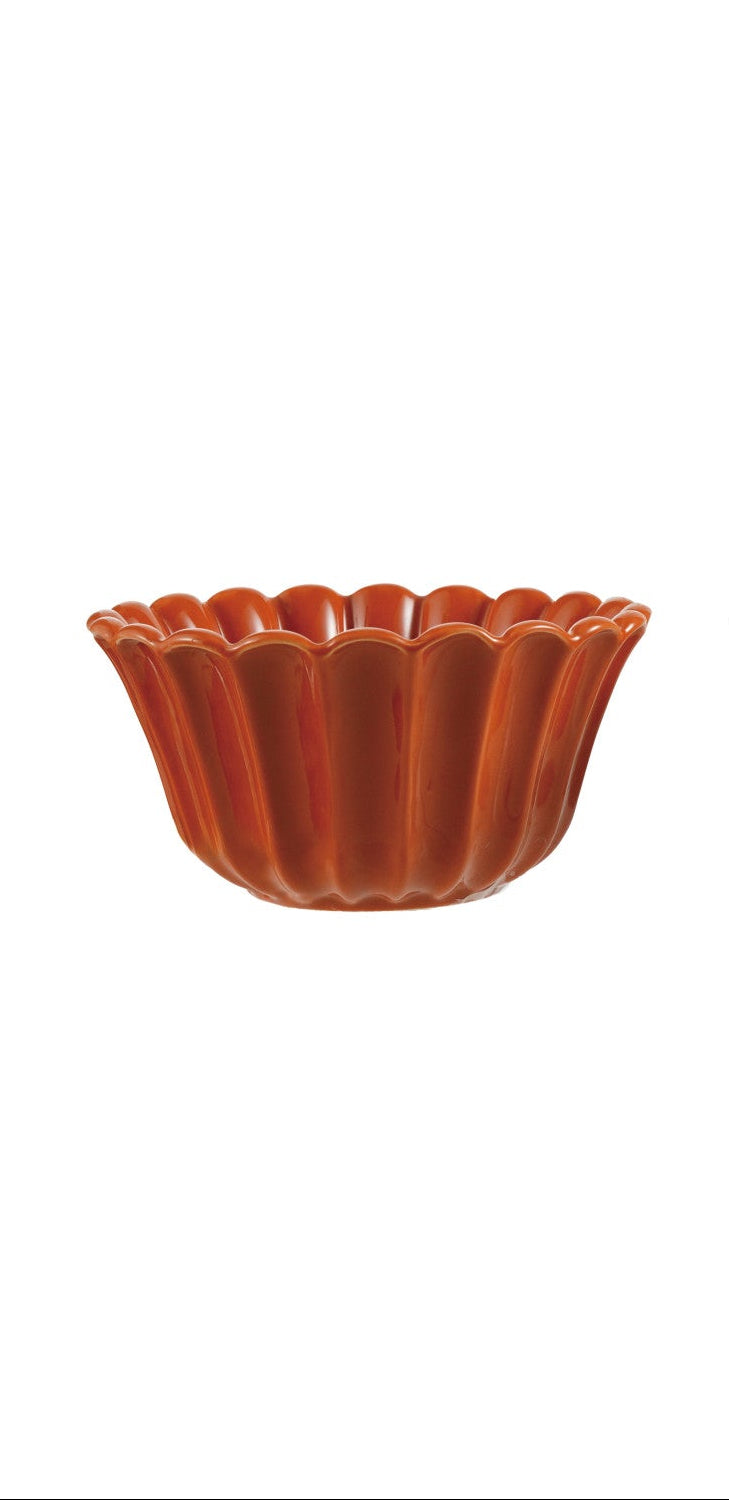 One orange ceramic stoneware bowl on a white background