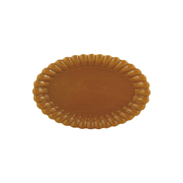 Brown platter with decorative edge on a white background