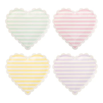 Four heart-shaped paper plates with pastel striped patterns on a white background