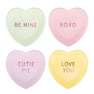 Four heart-shaped paper plates with Valentine's Day phrases on a white background