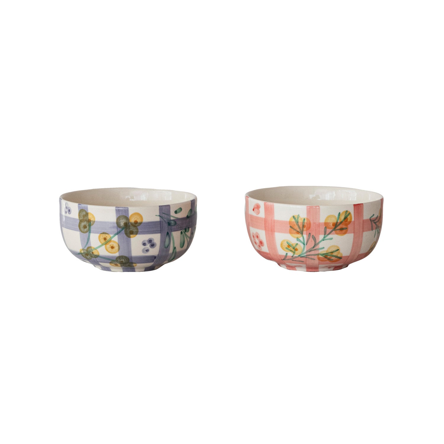 Two bowls with floral and plaid patterns on a white background