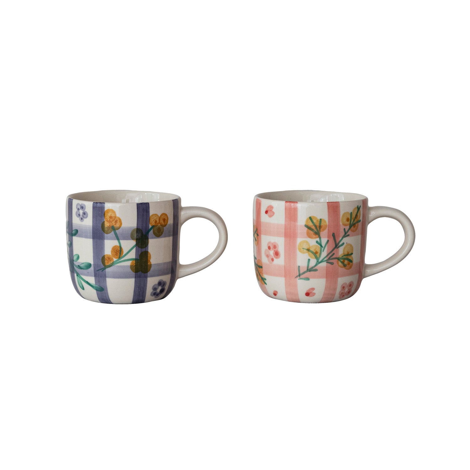 Two ceramic mugs with floral and plaid patterns on a white background