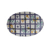 Oval platter with floral and checkered pattern on a white background