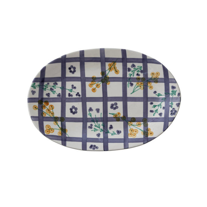 Oval platter with floral and checkered pattern on a white background
