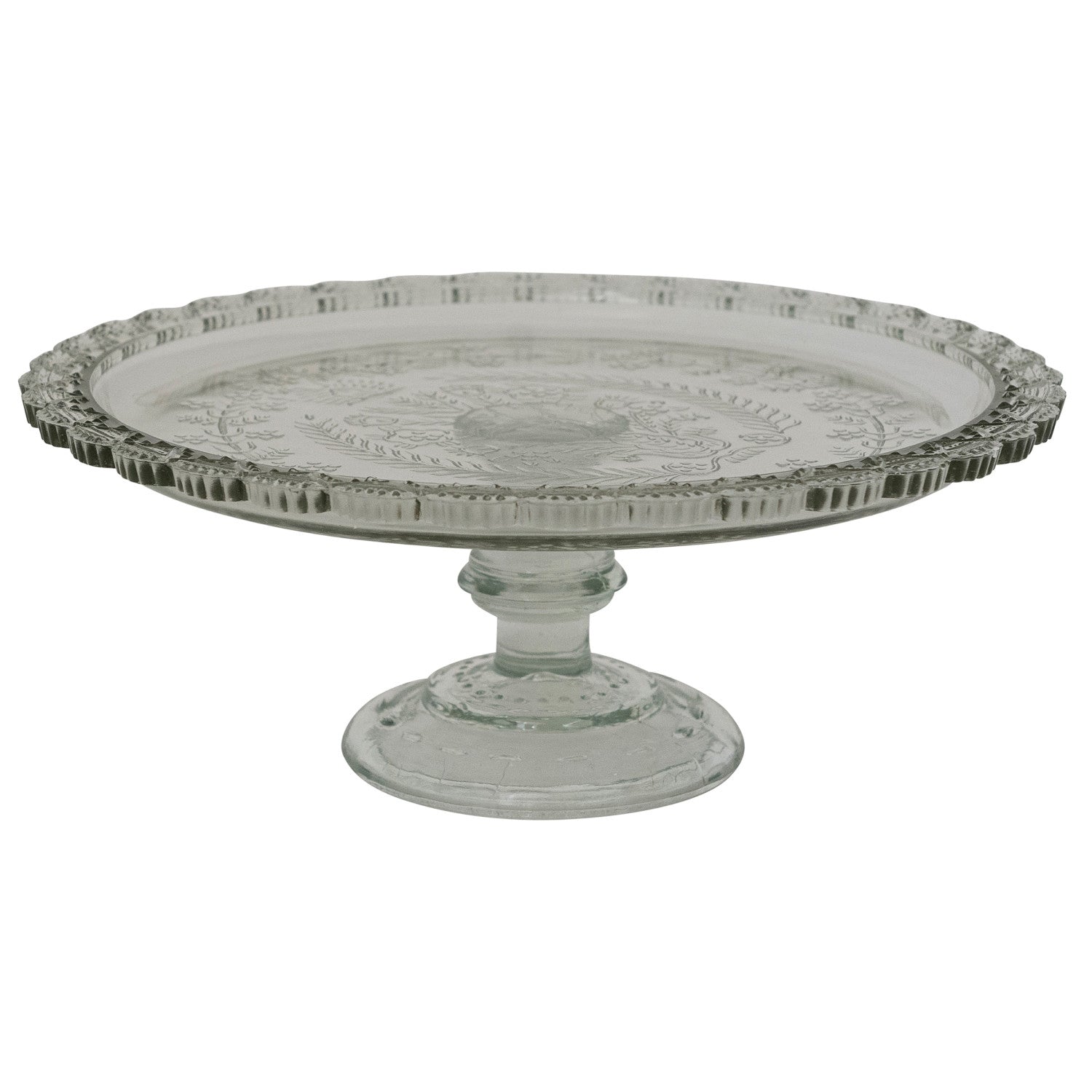 Decorative glass cake stand with intricate design on a white background