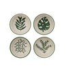 Four bowls with green leaf patterns on a white background