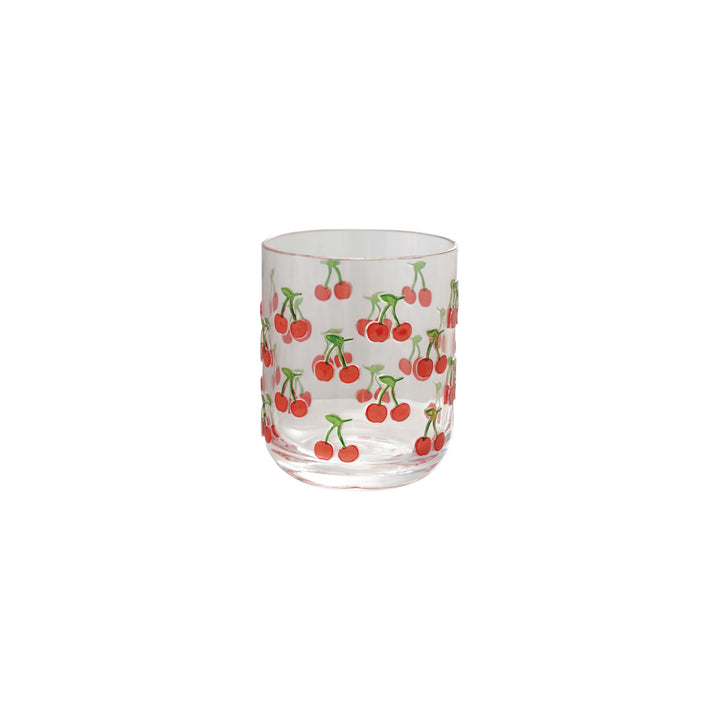 Clear glass tumbler with cherry pattern on a white background