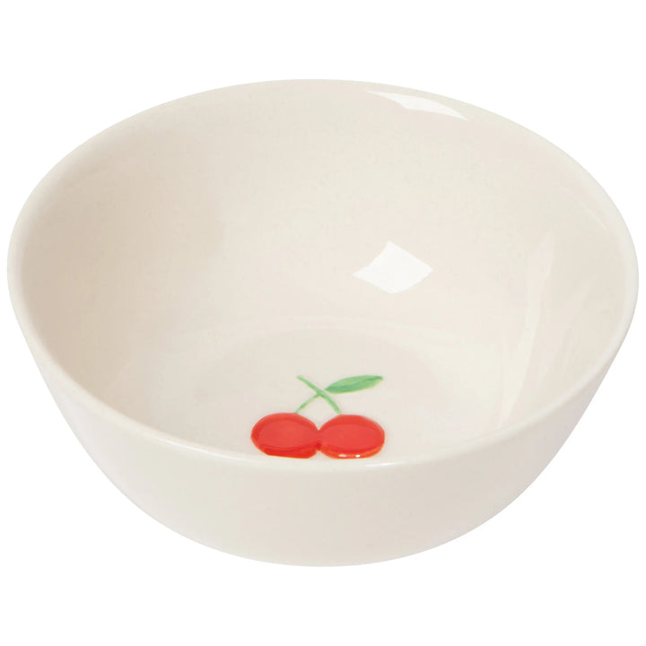 White stoneware bowl with red cherries design on a white background