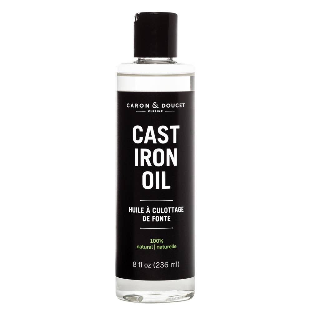 Bottle of Caron & Doucet Cast Iron Oil on a white background
