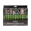 Packaged set of football-themed food picks with decorative sticks on a green field background.