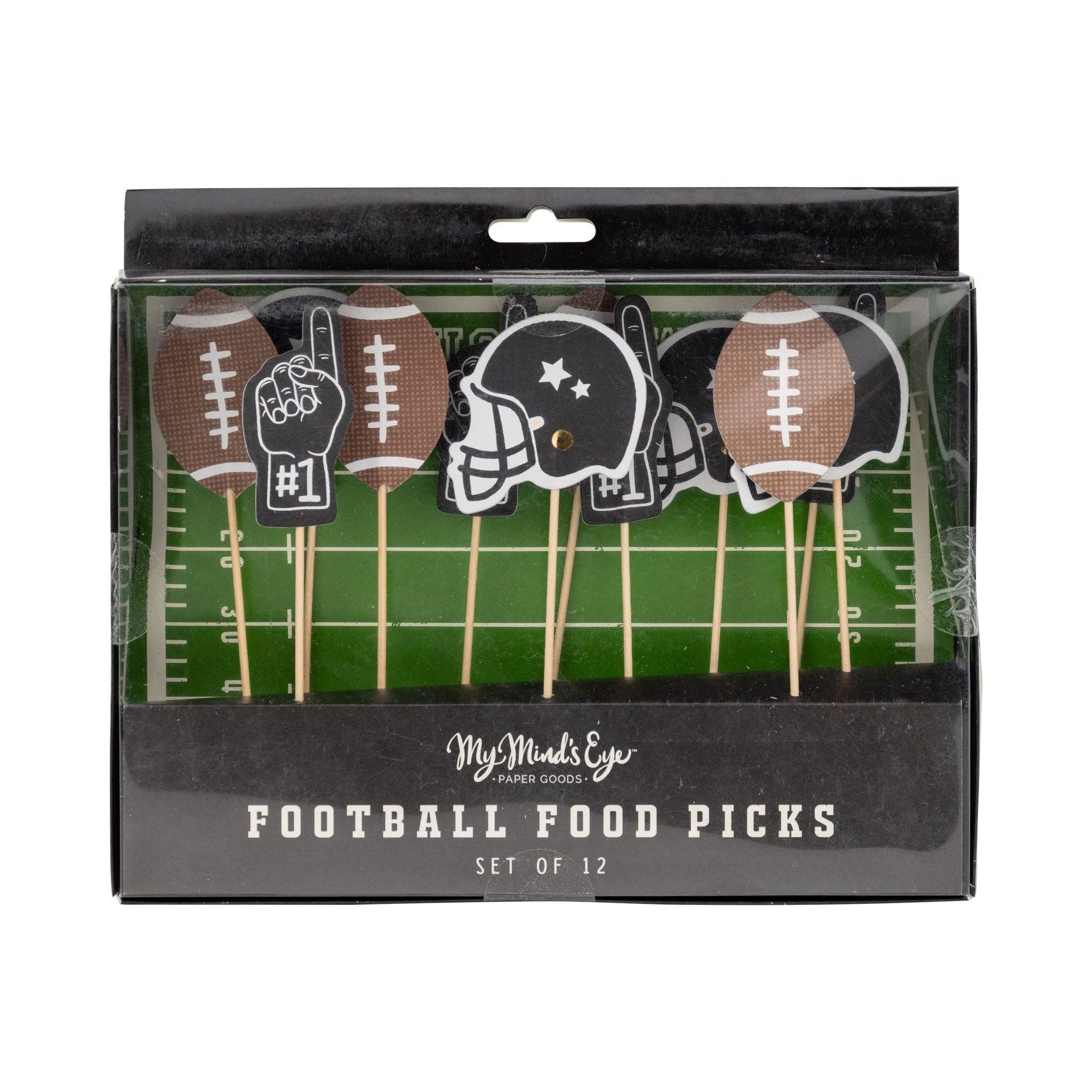 Packaged set of football-themed food picks with decorative sticks on a green field background.