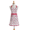 White apron with red and pink strawberry pattern on a mannequin against a white background