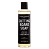 Bottle of Caron & Doucet Cutting Board Soap on a white background