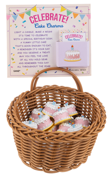 Wicker basket with cake charms and a 'Celebrate!' card on a white background