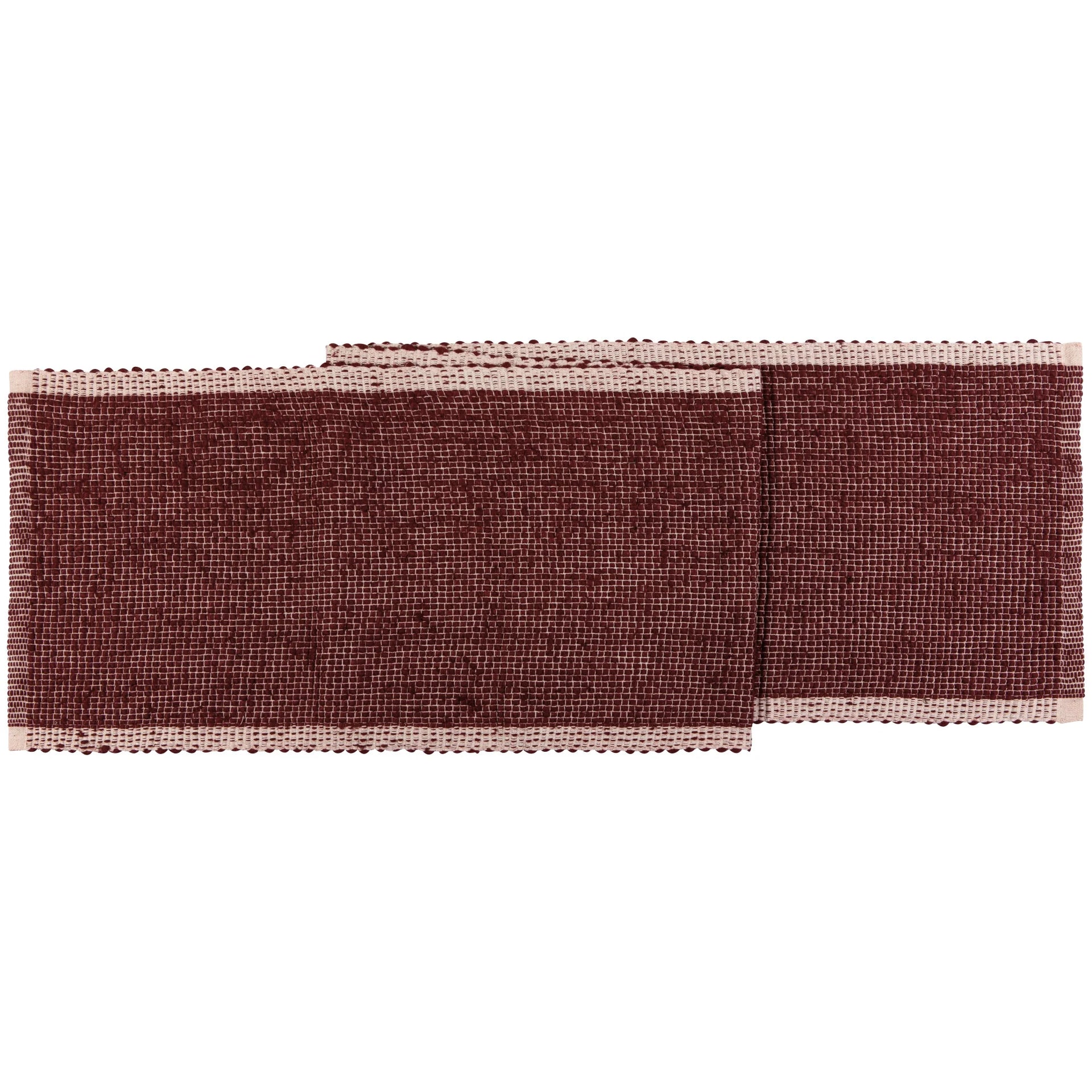 Woven table runner with a textured pattern on a white background