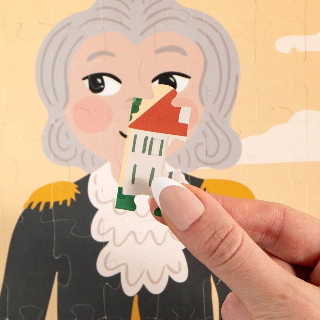 Hand holding a puzzle piece of a historical figure.