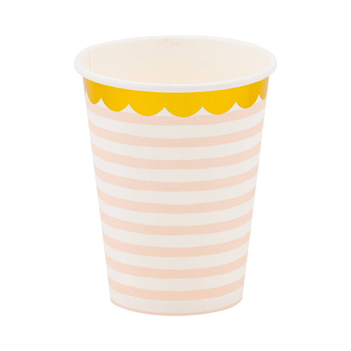 Paper cup with pink and white stripes and gold foil scalloped rim on a white background