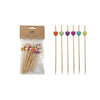 Packaged wooden skewers with colorful heart-shaped ends on a white background