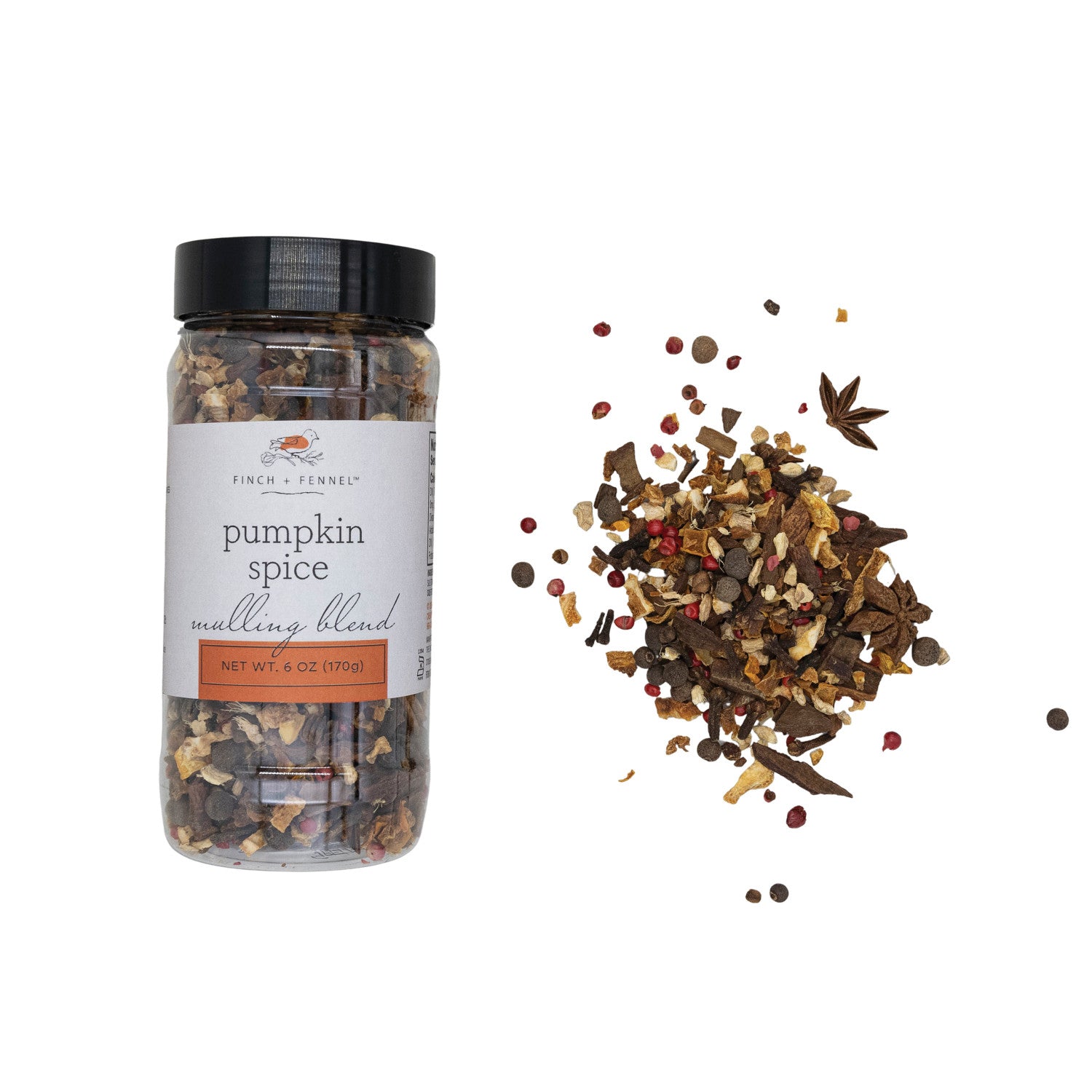 Jar of pumpkin spice mulling blend with scattered spices on a white background