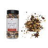 Spiced apple and ginger mulling blend with jar and scattered spices on a white background